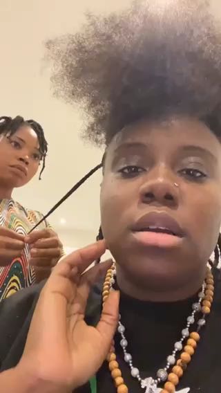 Teni makes her hair dresser smile so